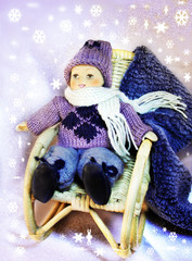  Puppe im Schaukelstuhl