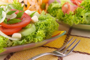 Fresh salad with onion, tomato and basil