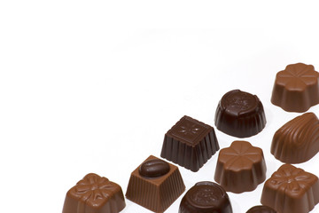 Assortment of milk and dark chocolates isolated on white