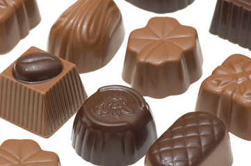 Assortment of milk and dark chocolates isolated on white