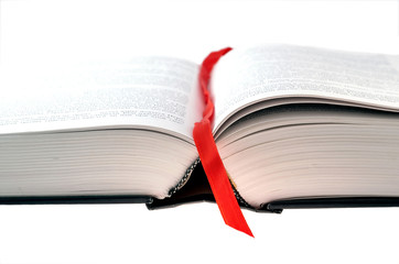 open book with red bookmark on white