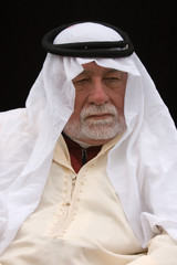 old arabian man listening