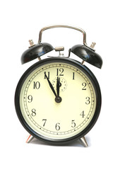 The black alarm clock is isolated on a white background