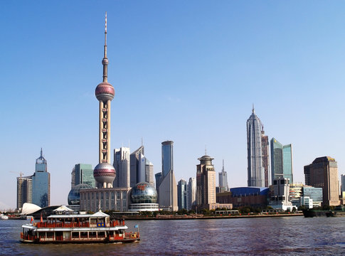 Shanghai - Skyline and traditional chinese boat