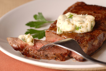 Grilled ribeye steak with a bernaise butter