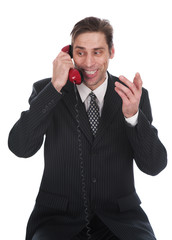 Naklejka premium The person speaks by the phone