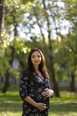 Fototapeta premium Pregnant woman in park #1