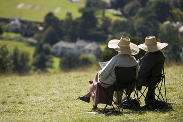 Two elderly people relaxing 