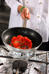 Chef preparing tomato
