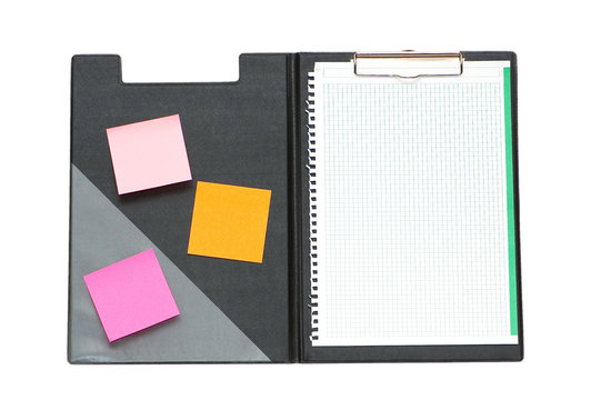 Open binder with post-it notes and blank page