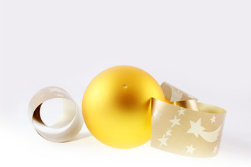 yellow christmas ball and ribbon