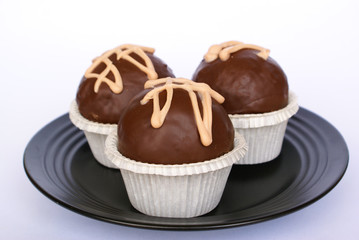 Brandy balls on black plate