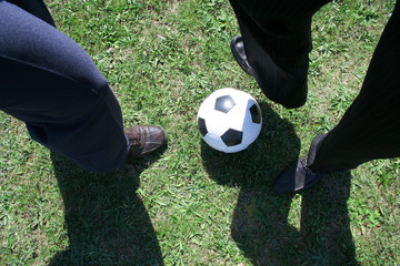 Businesspeople playing soccer