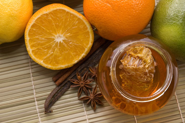 fresh honey with honeycomb, spices and fruits