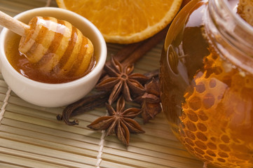 fresh honey with honeycomb, spices and fruits