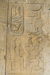 Egyptian hieroglyphs at stone bas-relief