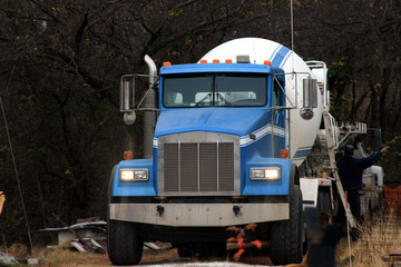 Concrete truck in the process of pouring a job