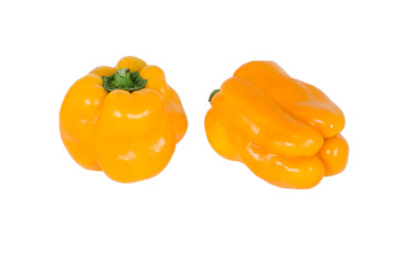 Two yellow bell peppers isolated on white background