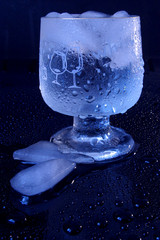 Glass of cold water with cubes of ice