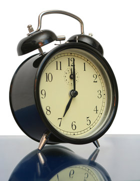 Black alarm clock on a white background