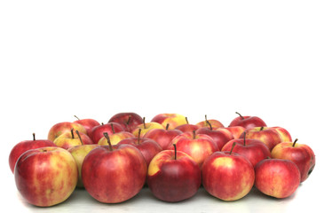 Many red apples on a white background