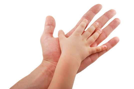 Man's hand supports kid's hand