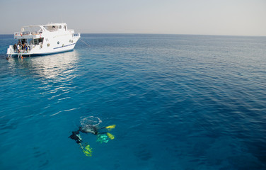 Divers and boat in the Red Sea - 5207828