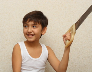 smiling boy with saw