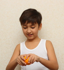 boy, peeling the orange