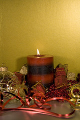 Christmas decorations with lit Candle