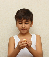 boy, peeling the orange