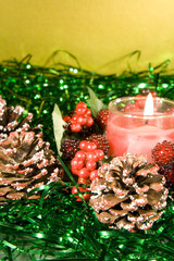 Christmas decorations with lit Candle
