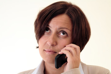 White businesswoman with handy, thinking