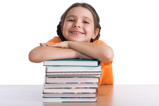 Young Schoolgirl With A Pile Of Books