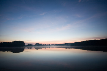 Fototapeta na wymiar blue morning sunshine on the lake