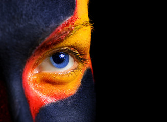 Naklejka premium Portrait of a mysterious woman with artistic make-up on her face