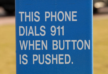 Sign giving instructions on dialing 911