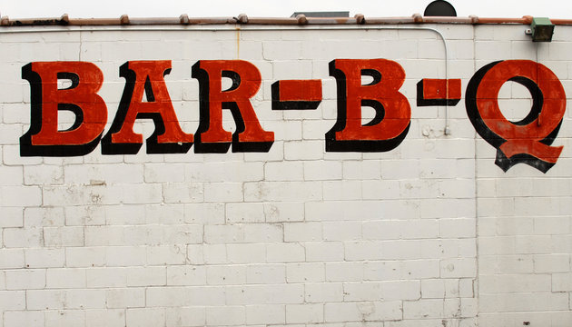 Bar-B-Q Sign On The Side Of A Building