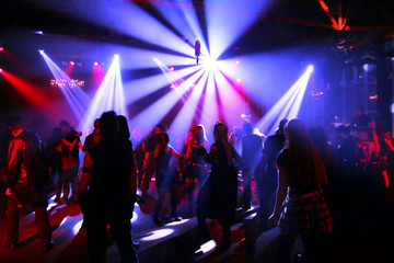 Fototapeta Dancing people in an underground club obraz