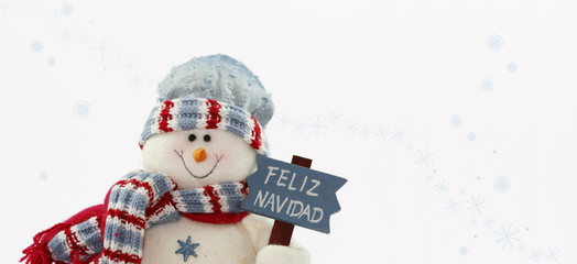 muñeco de nieve con un letrero de feliz navidad