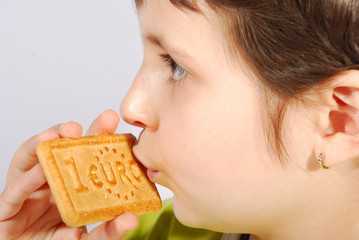 Kid eating euro cookie  