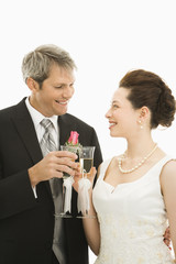 Bride and groom toasting.