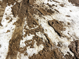 Dirt road with snow.