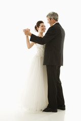 Bride and groom dancing.