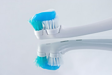Fototapeta na wymiar electric toothbrush reflections