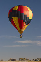 hot air balloon over farmland of southern Colorado