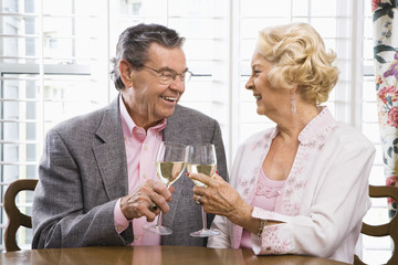 Mature couple toasting.