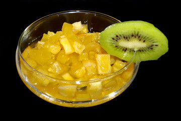 glass of sweet yellow jam and kiwi
