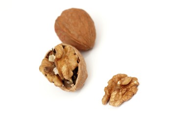 pieces of walnuts on white background
