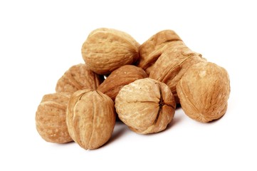 several walnuts on white background